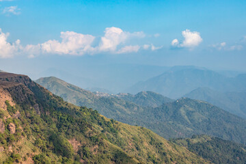mountain layers covered with white mists and forests at morning