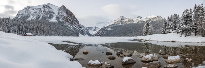Incredible Lake Louise during winter time with scenic  landscape in panorama, panoramic view with...