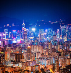Fototapeta premium epic view of Hong Kong Night, from Kowloon to Hong Kong Island. metropolis in Asia, aerial, amazing colorful cityscape