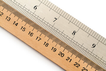 Wooden and metal rulers in centimeters and inches.