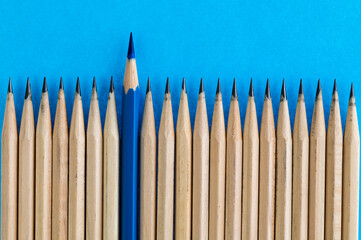Blue pencil standing out from the crowd