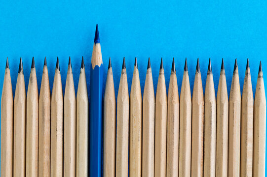 Blue Pencil Standing Out From The Crowd