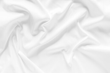 Obraz premium White fabric texture background. Cloth soft wave. Creases of satin, silk, and cotton.