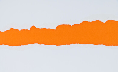 Torn paper on orange background
