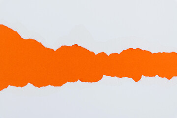 Torn paper on orange background