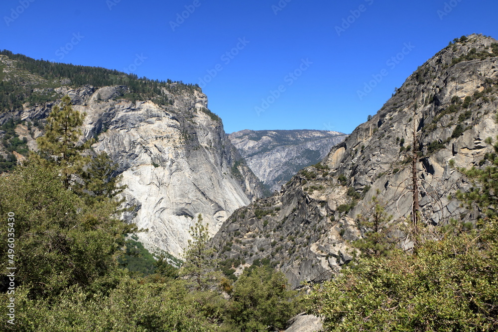 Wall mural The Merced River flows at the bottom of Tenaya Canyon in Yosemite National Park, California