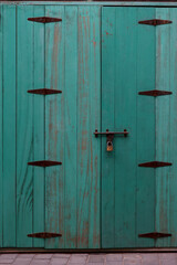  old wooden door closed  aqua color