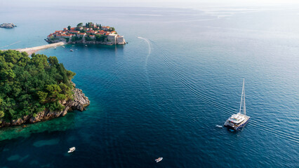 View from flying drone. Panoramic view of Sveti Stefan island in a beautiful summer day, Montenegro.Top View. Beautiful destinations.
