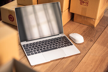 Shopping online concept packing parcel box. Small business owner packing in the card box at workplace, work from home. packing parcel box for online shipping delivery. small home business.