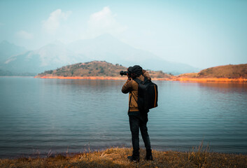Man travel photographer with camera, Backpacker taking nature image