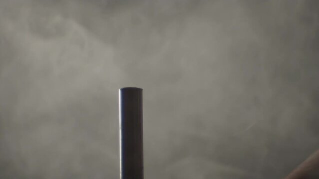 Hammer hitting a big nail in a dramatic misty ambience