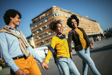 Young parents taking their little child to school