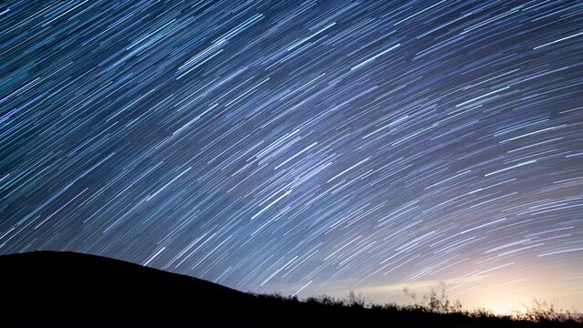 Startrails Over Grassy Hill Spring Season Astrophotography Time Lapse