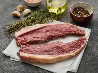 Two Raw cap rump steak or top sirloin beef meat steak. Picanha steak with spices