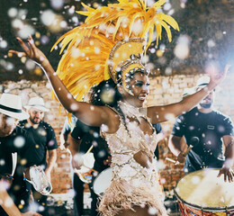 Our night to shine. Cropped shot of a beautiful samba dancer performing in a carnival with her band. - obrazy, fototapety, plakaty
