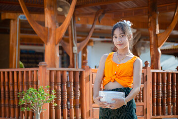 Girl in traditional Thai dress Songkran Festival in Thailand