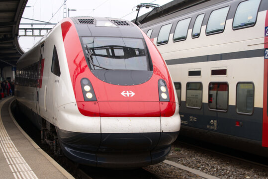 SBB train arriving at railway station Gen&egrave;ve-Cornavin at City of Geneva on a cloudy spring day. Photo taken March 18th, 2022, Geneva, Switzerland.