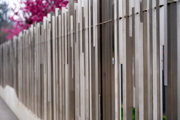 Metal fence with abstract geometric pattern at City of Geneva on a cloudy spring day. Photo taken March 18th, 2022, Geneva, Switzerland.