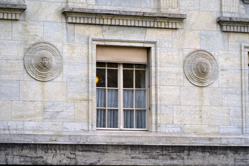 Fototapeta na wymiar Close-up of stone wall of federal supreme court of Switzerland with round ornaments. Photo taken March 18th, 2022, Lausanne, Switzerland.