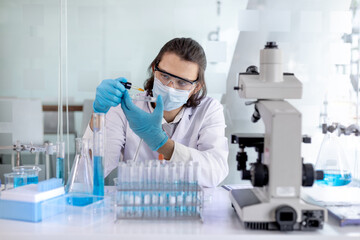 Fototapeta premium Scientists experiment with synthetic substances from nature to modify the genetics or DNA of plants to be resistant to disease, Lab experiments, Researchers scientist working analysis with test tube.