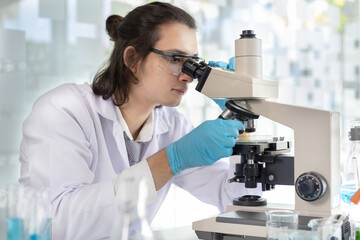 Scientists or researchers perform microscopic endoscopy to examine changes in the chemical reactions and degradation of cells, Lab experiments, Researchers scientist working analysis with test tube.