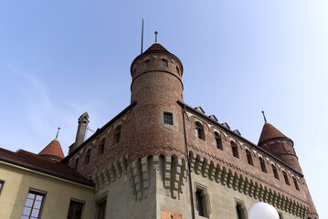 Fototapeta premium Medieval Château Saint-Maire (St. Maire Castle) at City of Lausanne on a spring day, official residence of the Government of Canton Vaud. Photo taken March 18th, 2022, Lausanne, Switzerland.