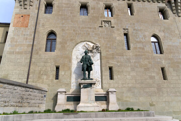 Fototapeta na wymiar Statue of Major Davel in front of Medieval Château Saint-Maire (St. Maire Castle) at City of Lausanne on a spring day. Photo taken March 18th, 2022, Lausanne, Switzerland.