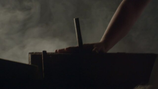 Hammer hitting a big nail in a dramatic misty ambience