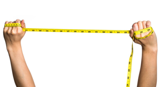 Hand holding tape measuring on white background