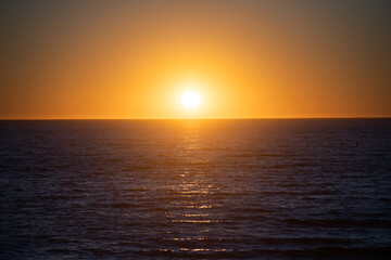 Calm sunrise sunset over the sea waves. Sunrise over the ocean.