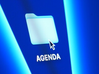 Agenda - macro shot of folder on computer desktop with mouse pointer - zooming in on screen pixels