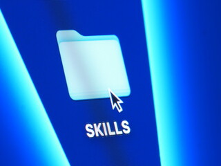 Skills - macro shot of folder on computer desktop with mouse pointer - zooming in on screen pixels