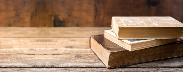 Old books on wooden shelf. Education learning concept with old book in library. Copy space