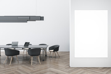Modern and wooden concrete meeting room interior with empty white mock up banner on wall, furniture, ceiling lamp and laptop device on table. Workplace and conference concept. 3D Rendering.