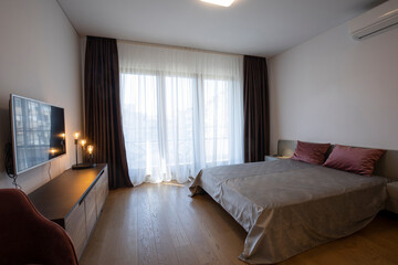 Interior of a bedroom with large master bed