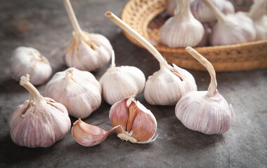 Garlic bulbs on the stone background.