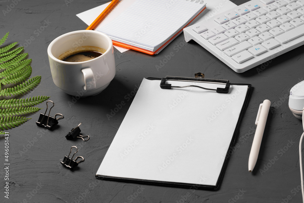 Poster Clipboard mock up on home office workspace with coffee cup and stationery