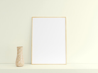 Customizable minimalist vertical wooden poster or photo frame mockup on the podium table with vase