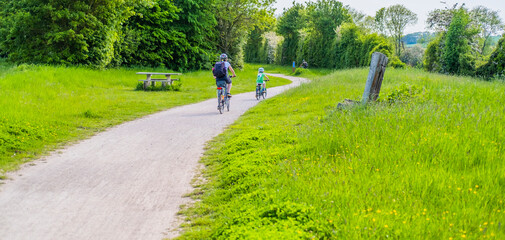 People walking and riding bicycles. Greenway hiking and cycling trail Stratford upon Avon Warwickshire England UK