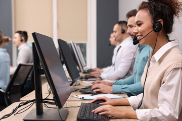 Call center operators working in modern office