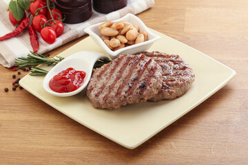 Grilled beef burger cutlet with sauce