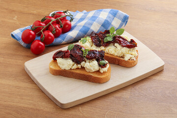 Bruschetta with soft cheese and tomato