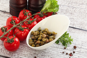 Marinated green capers in the bowl