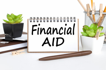 Financial Aid. text on notepad on white background