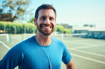 As an athlete, fitness always comes first. Portrait of a sporty young man listening to music while...