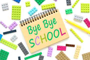 bye bye school. text on craft notepad near colorful cubes