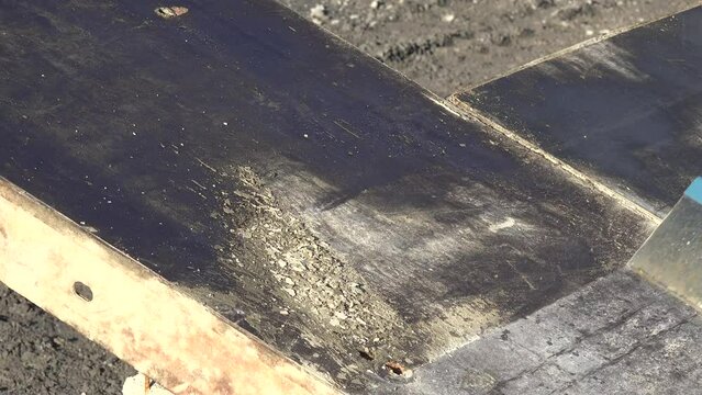 Man cleaning a concrete protection panel with a high pressure cleaner, High quality 4k footage