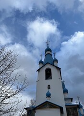 Russian orthodox church, white walls and blue cupolas  © Oksana