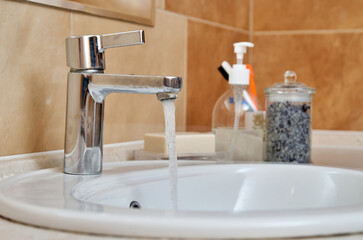 Close-up of faucet and sink in bathroom