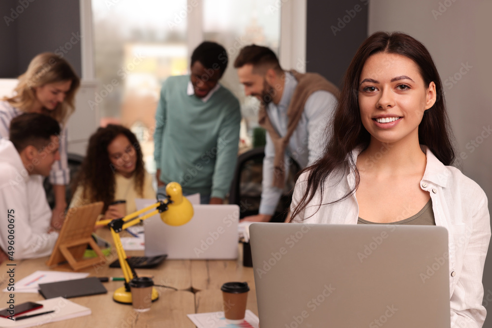 Sticker Portrait of happy young woman with laptop in office, space for text. Startup project